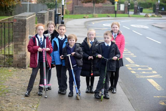Seaburn Dene Primary School pupils walking, scooting and using a pogo stick to get to school as part of an initiative to promote sustainable travel.