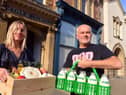 Sunshine Co-operative owners Claire Wayman and Wojtek Bozik with locally produced milk and organic fruit and veg box.