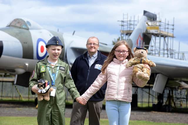 David Charles of North East Land, Sea and Air Museums gives autistic youngster Jack Berry, 13 and cousin Maisie Jones, eight, a special tour of  the NELSAM