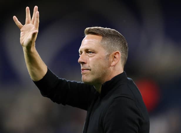 HUDDERSFIELD, ENGLAND - SEPTEMBER 13: Leam Richardson, Manager of Wigan Athletic acknowledges fans prior to the Sky Bet Championship between Huddersfield Town and Wigan Athletic at John Smith's Stadium on September 13, 2022 in Huddersfield, England. (Photo by Charlotte Tattersall/Getty Images)
