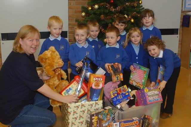 Children supported the Salvation Army's toy appeal in 2004 and here they are with Julie Judson.
