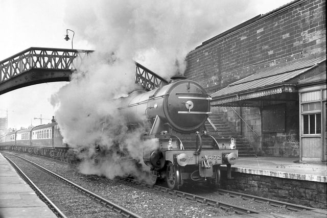 The Flying Scotsman in May 1968. A battery of cameras greeted a fleeting visit by The Flying Scotsman as she steamed into Sunderland. The gleaming engine, pulling a number of coaches, and belching smoke, steamed slowly through to allow train spotters and railway workers to have a good look as this scene from the past.