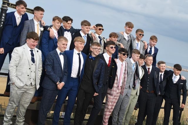 Year 11 boys dressed in a range of stylish suits.