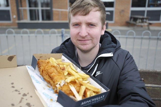 Callum Sinclaire, 26, shows off his giant fish from Minchella's Fish and Chip shop.

Picture by FRANK REID