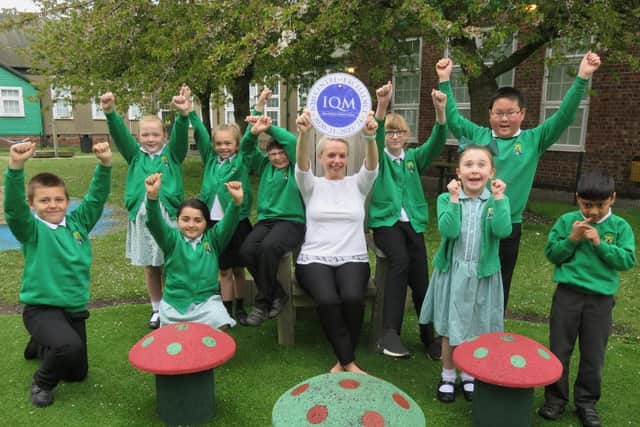 West Rainton Primary School deputy head Susan Firth and pupils celebrate the school's second successive Inclusion Quality Mark Award.