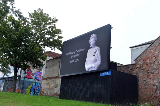 A tribute to Queen Elizabeth II projected onto one of the city's digital screens.