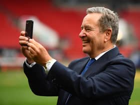 BRISTOL, ENGLAND - JUNE 20: Presenter Jeff Stelling interacts with their mobile phone following the Vanarama National League Play-Off Final match between Hartlepool United and Torquay United at Ashton Gate on June 20, 2021 in Bristol, England. (Photo by Harry Trump/Getty Images)