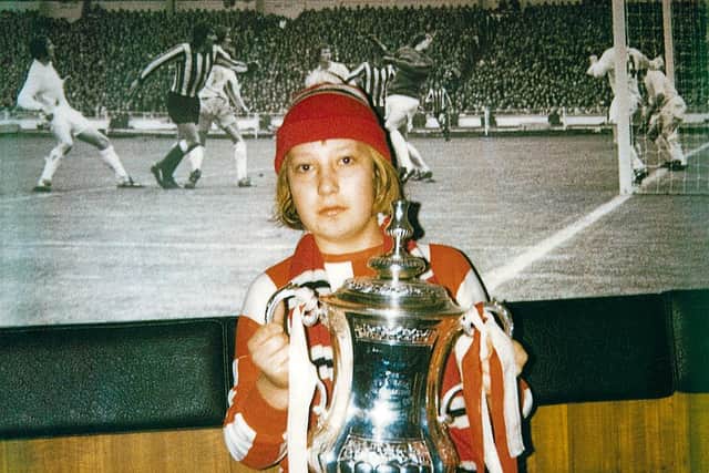 Michael holding the FA Cup.