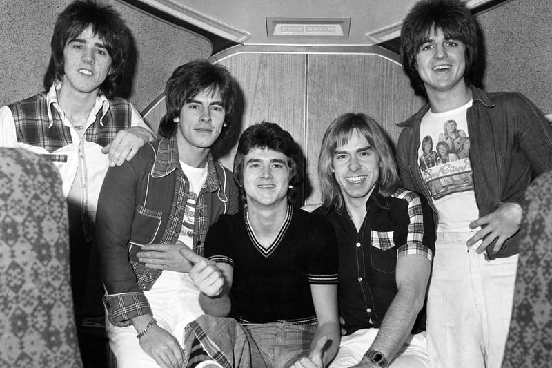 The Bay City Rollers (left to right) Stuart Wood, Alan Longmuir, Leslie Mckeown, Derek Longmuir, and Eric Faulkner on board a jumbo jet at London's Heathrow Airport before leaving for Perth and a tour of Australia.