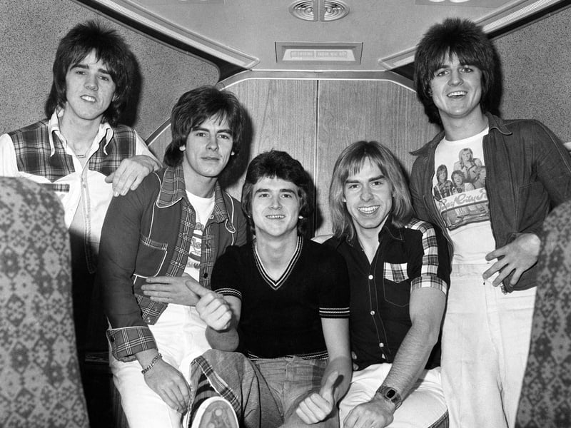 The Bay City Rollers (left to right) Stuart Wood, Alan Longmuir, Leslie Mckeown, Derek Longmuir, and Eric Faulkner on board a jumbo jet at London's Heathrow Airport before leaving for Perth and a tour of Australia.
