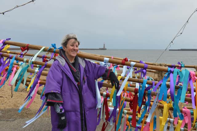 The Greek galley is taken into the sea at Roker Beach by local wild swimmers as part of the The National Theatre play. Wild swimmer and cast member Sue Kerton.
