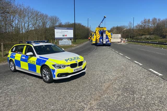 Police on the scene of the collision on the A690.
