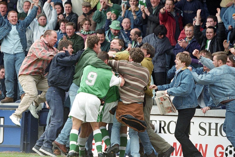 Pat McGinlay (hidden from view) is mobbed my Hibs fans after scoring against Raith Rovers at Stark's Park in May 1997