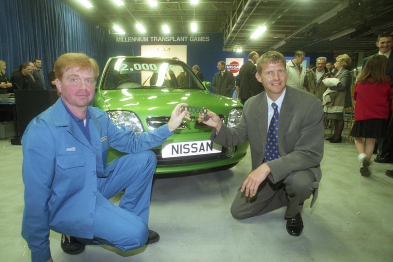 Olympian Steve Cram, right, with the Nissan plant's two millionth car in 1999.