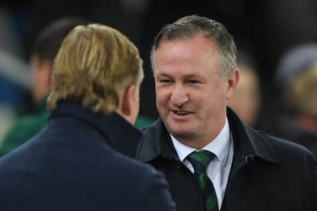 BELFAST, NORTHERN IRELAND - NOVEMBER 16: Northern Ireland manager Michael O'Neill greets his Dutch counterpart Ronald Koeman prior to the UEFA Euro 2020 qualifier between Northern Ireland  and The Netherlands at Windsor Park on November 16, 2019 in Belfast, Northern Ireland. (Photo by Mike Hewitt/Getty Images)