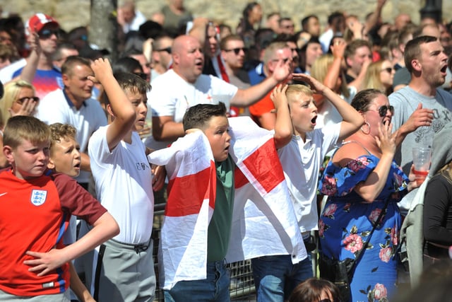 England fans celebrate the teams win over Sweden in their World Cup Quarter Final match, at the Fanzone in 2018.