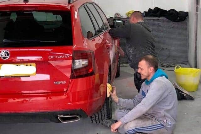 Staff at Auto Body Repair Centre fixing the car