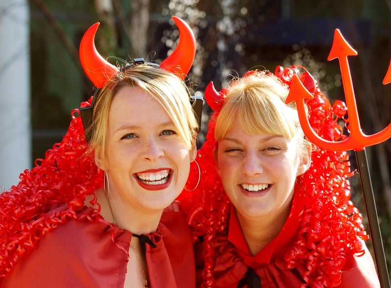 Sara Smith and Lynsey Sutherland dressed as red devils for Comic Relief at London Electric in 2003.