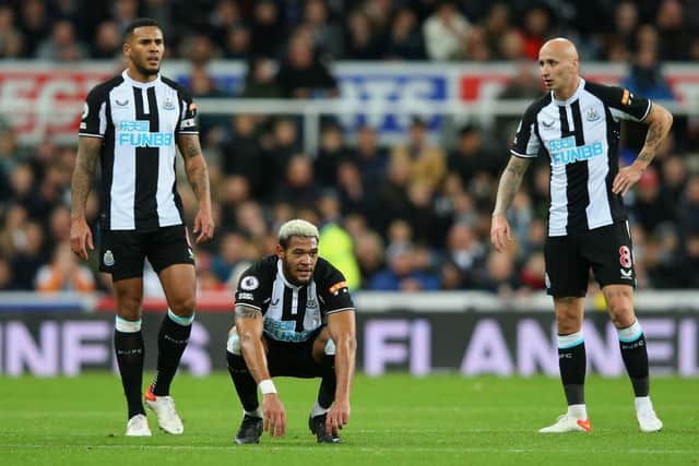 Jamaal Lascelles, Joelinton and Jonjo Shelvey after the final whistle against Brentford.