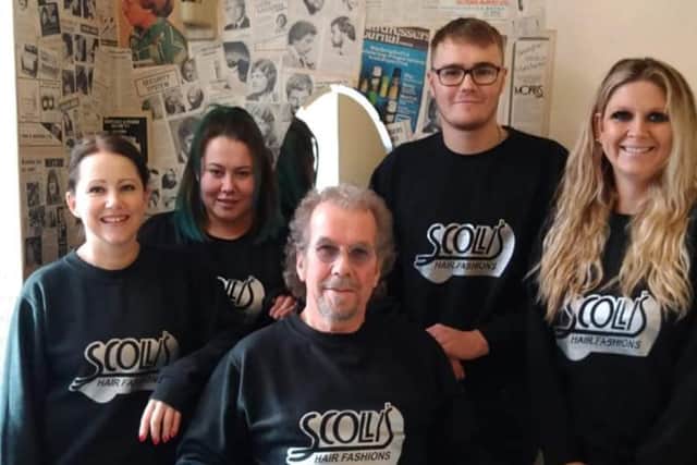 The Scolli's team as seen in February 2020. Founder John Scollen is seated, front.