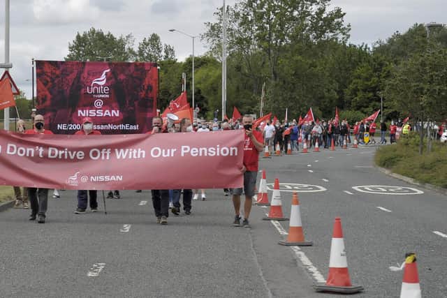 Workers protest at Nissan over proposed pension changes.