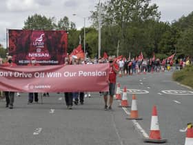 Workers protest at Nissan over proposed pension changes.