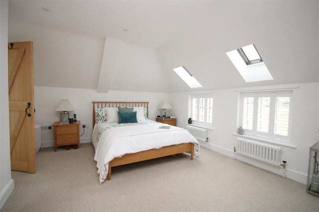 This wonderfully positioned, spacious double bedroom, has views over the garden, paddocks and open fields beyond.