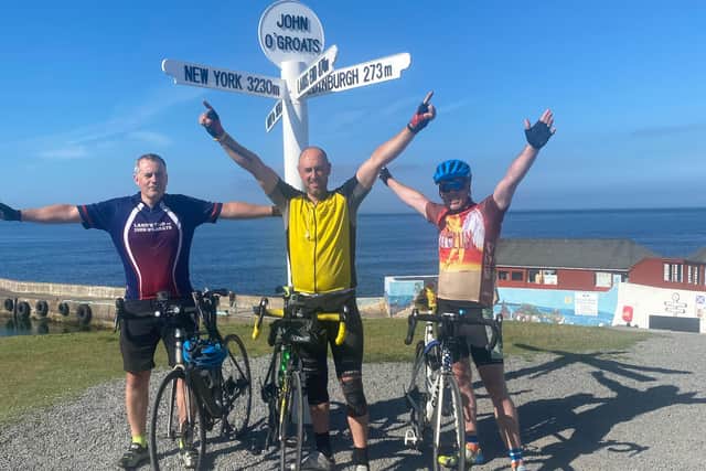 From left: Barry Haley, Mick Hooper and Michael Fletcher at the finish line in John O'Groats.