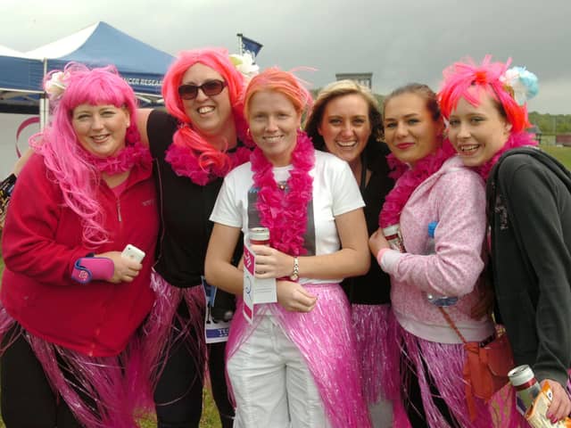A scene from the Race for Life 10k event in 2011. It shows staff from the Sibling Nursery, at Sunderland Business and Innovation Centre, getting ready to run.