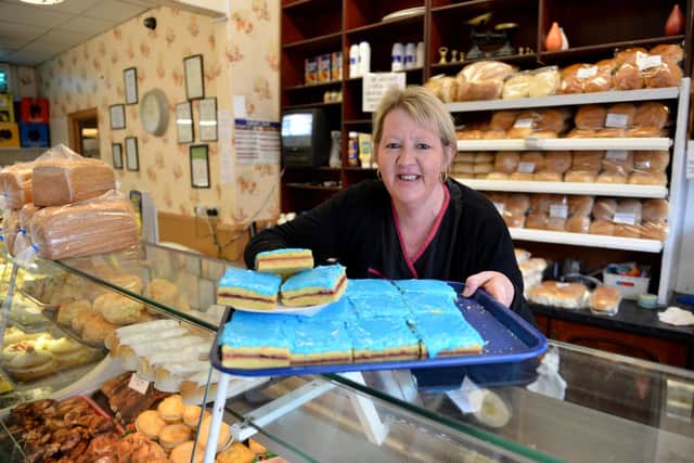Juliet Gaughan with her Blue Slices. The deli in Sea Road has good social distancing measures in place and is proving popular with local shoppers