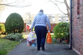 A local resident making their weekly trip from Mickey's Place food collection bank at St Michael's and All Angels Church.