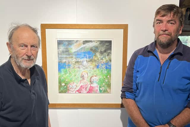 Barrie West, left, with artist Mike Clay next to one of Mike’s paintings.