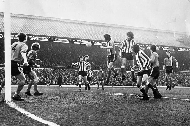 Dave Watson (third left) hammered home the first goal to shape Sunderland's 2-0 win.  He is pictured here racing in to meet a left wing corner by Bobby Kerr and direct a powerful header well out of Keith Barber's reach.
