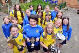 St Benet’s RC Primary’s girls team has added another two trophies to their cabinet. Picture by Stu Norton.