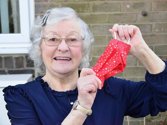 Sylvia McBeth with one of the many face masks she hand made to raise funds in aid of St Benedict's hospice. Picture by FRANK REID