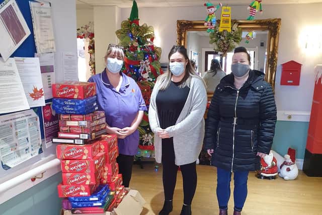 Staff at Washington Manor Care home receiving their biscuits for the residents from The Little Onion Club