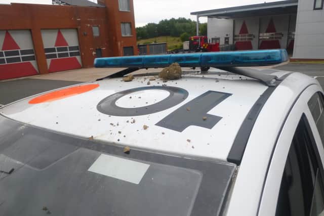 A damaged police car at Farringdon Fire Station.