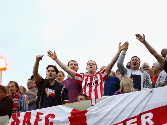 Sunderland fans celebrate their team's second goal during the League One match between Gillingham and Sunderland at Priestfield Stadium on August 22, 2018.