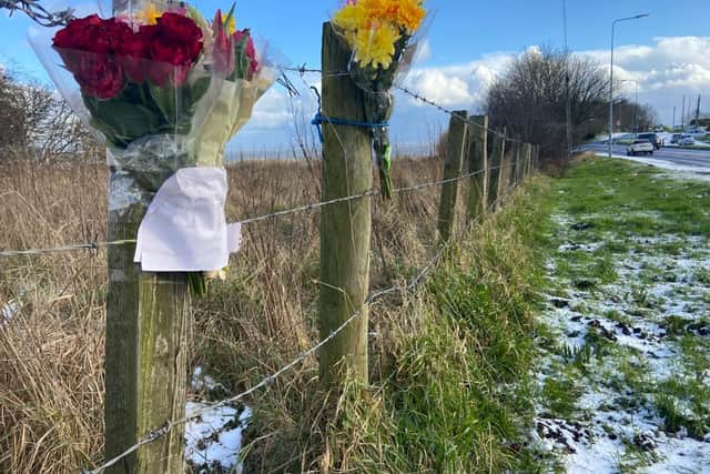 Flowers have been left at the scene following the tragic loss of a woman in a two-car crash at the weekend.