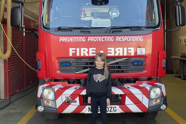 Olivia Ramsay, seven, alerted firefighters to a fire in her next door neighbour's kitchen.