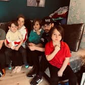 The Stewart family have been left devastated by the death of Thomas Stewart, 53, and are appealing for help to cover the cost of the funeral. (Left to right) Shannon, 24, Milly, 16, Finley, 11, Mum Selina, 41, with Niall, 4, Leyland, 10, Sean, 18, and Daniel, 7.
