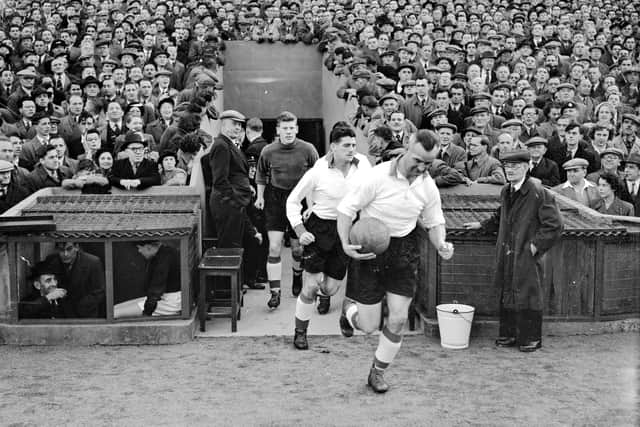 Sunderland take to the pitch,led out by captain Fred Hall followed by Trevor Ford and keeper Harry Threadgold.
