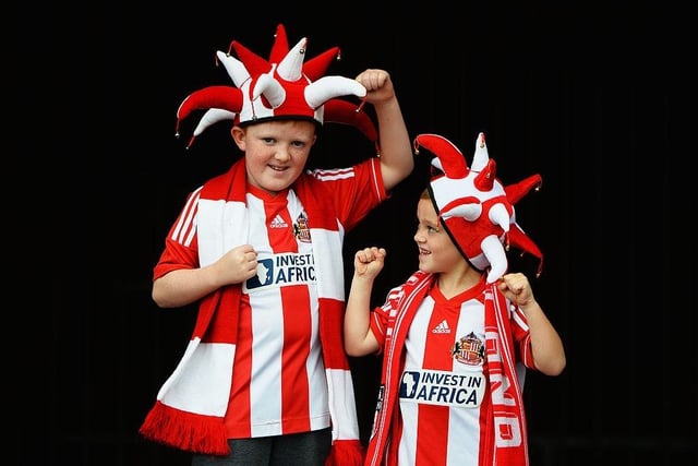 Young Sunderland fans pose prior to the Premier League match against Arsenal at the Stadium of Light on September 14, 2013.