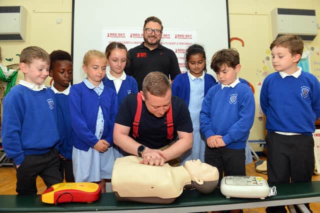 Chris Smith and Red Sky Foundation founder Sergio Petrucci during one of the first aid sessions at St Mary's RC Primary School.