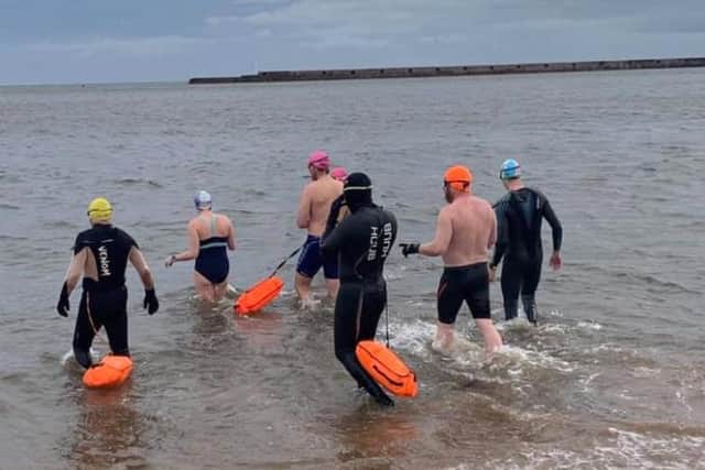 A shot from the 100 day challenge swim SCSK Facebook page, as Leroy Arkley was accompanied by a group of fellow sea swimmers on one of his 100 dips.