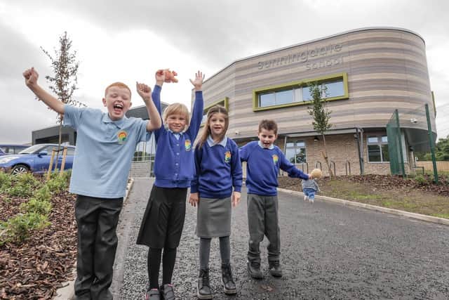 Pupils Kai, Layla, Isla and Ollie celebrate the opening of their new school.

Photograph: Will Walker / North News