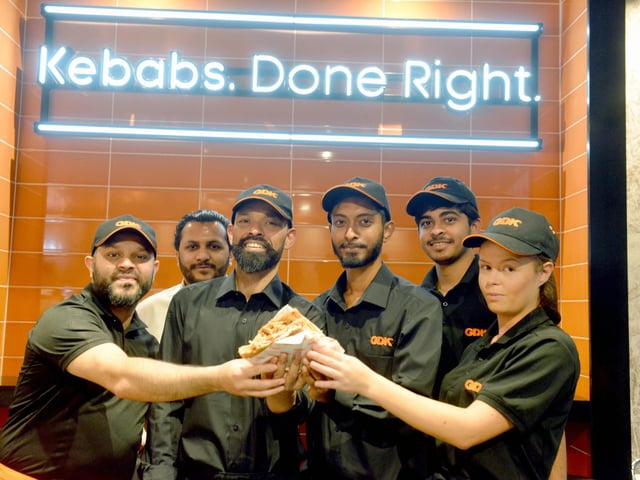 Franchisee Kamal Ahmad, third from left, with his management team.