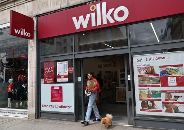 A shopper leaves a branch of Wilko, the high street retailer facing closure.