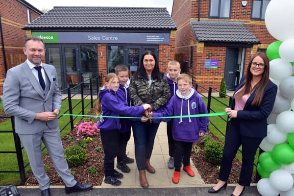 Gemma Lowery unveils the Hardwicke Place Gleeson Homes show house with children from Blackhall Primary School.