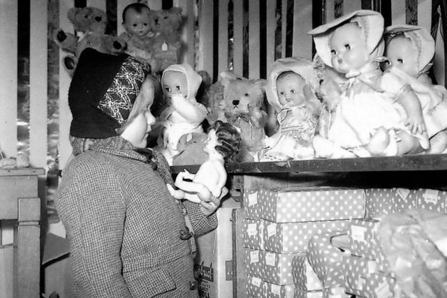 Choosing a doll at Joplings in 1953. Was it one of your favourite stores to visit? Photo: Bill Hawkins.